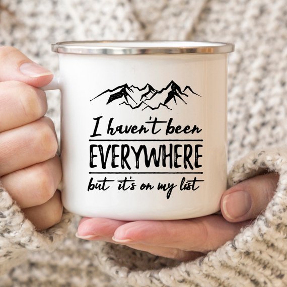 Wanderlust Enamel Mug featuring a vibrant design, crafted from cast iron with a stainless steel rim, perfect for camping and outdoor adventures.