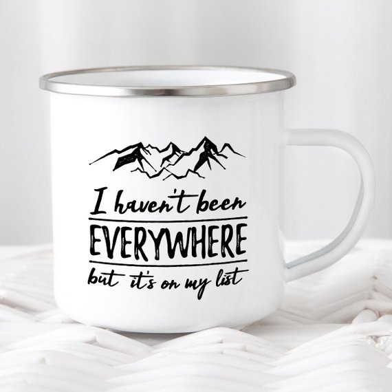 Wanderlust Enamel Mug featuring a vibrant design, crafted from cast iron with a stainless steel rim, perfect for camping and outdoor adventures.