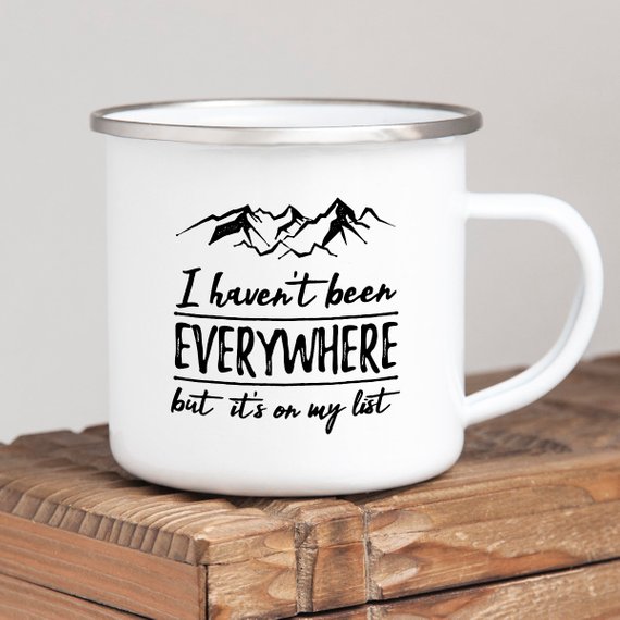 Wanderlust Enamel Mug featuring a vibrant design, crafted from cast iron with a stainless steel rim, perfect for camping and outdoor adventures.