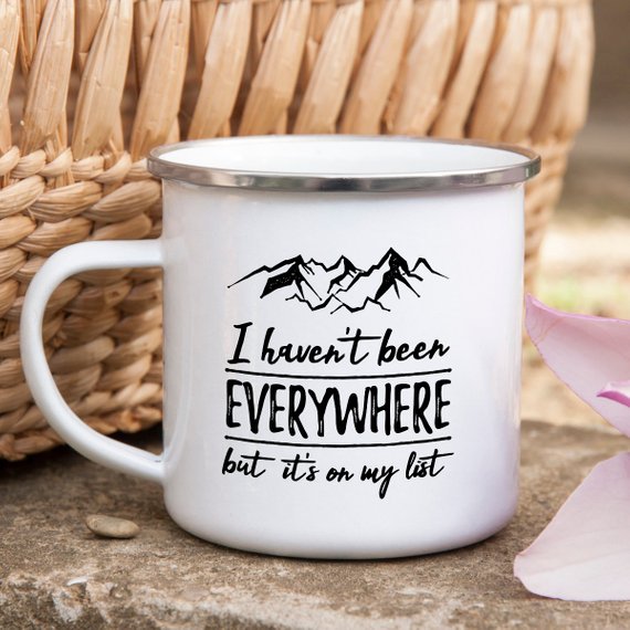 Wanderlust Enamel Mug featuring a vibrant design, crafted from cast iron with a stainless steel rim, perfect for camping and outdoor adventures.