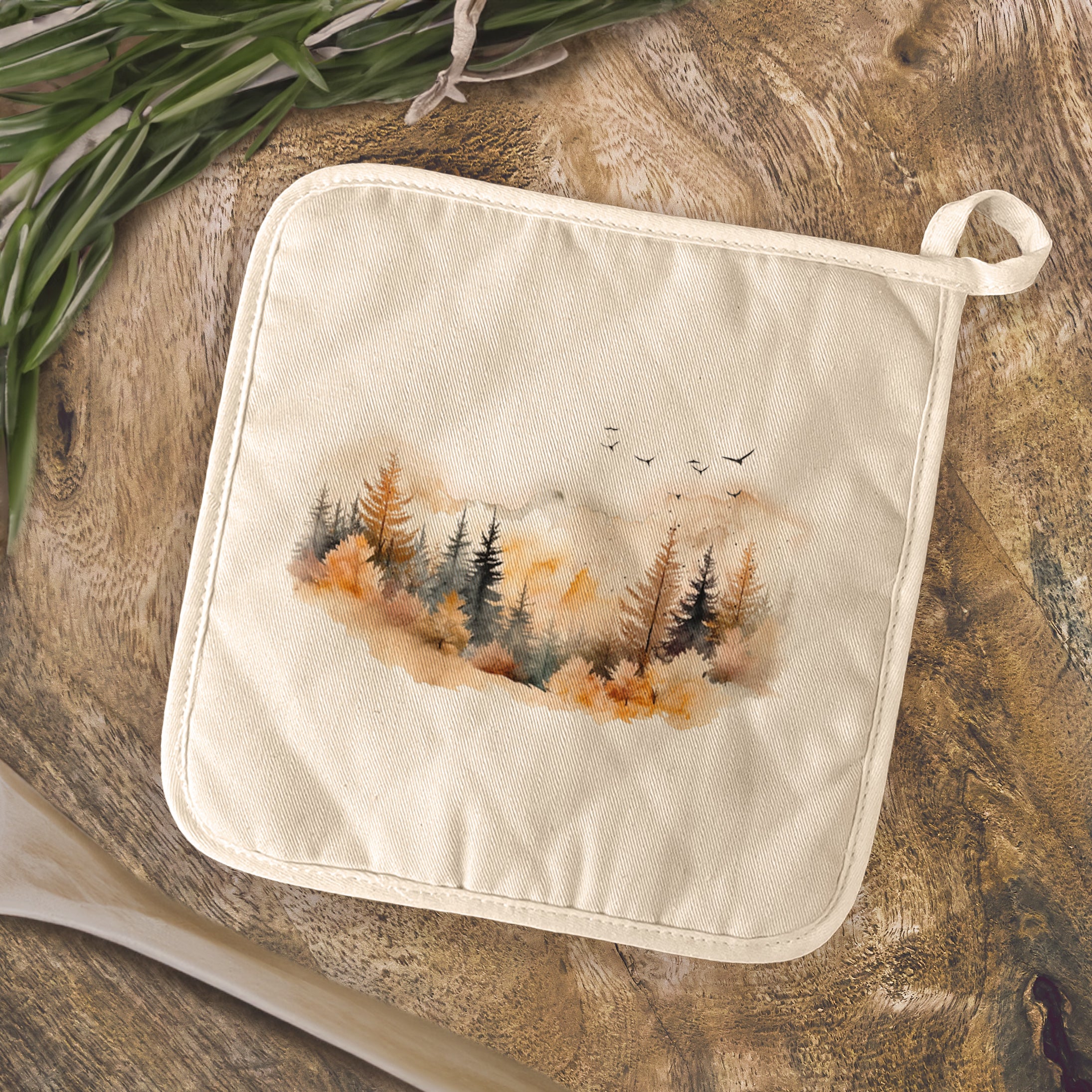 Warm Watercolor Mountains cotton pot holder featuring a vibrant mountain design, perfect for protecting surfaces from hot cookware.