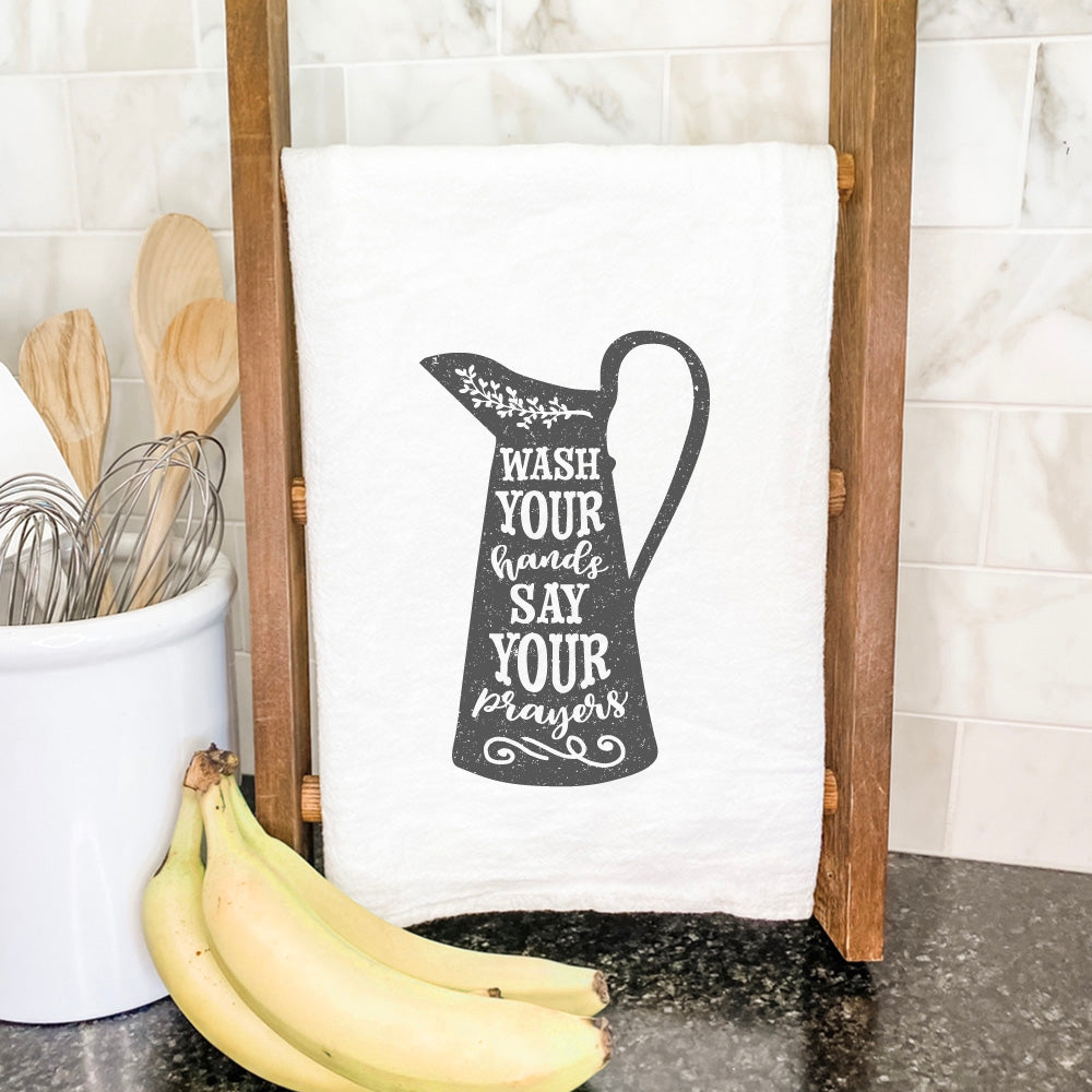 A vibrant cotton tea towel featuring a pitcher design, perfect for kitchen use.