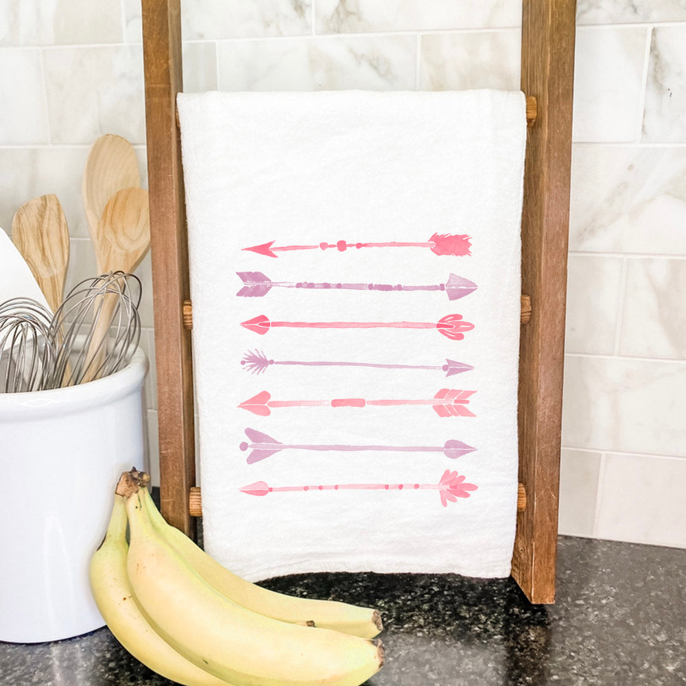 A vibrant Watercolor Arrows Cotton Tea Towel featuring colorful arrow designs on a white background, perfect for kitchen use.