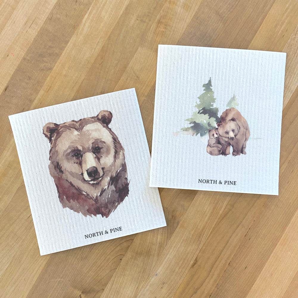 Two Swedish dish cloths featuring watercolor bear designs, eco-friendly and reusable.