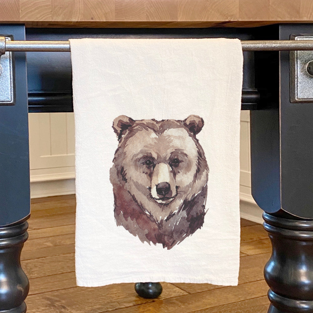 A vibrant watercolor bear head design on a cotton tea towel, showcasing its artistic appeal and high-quality fabric.