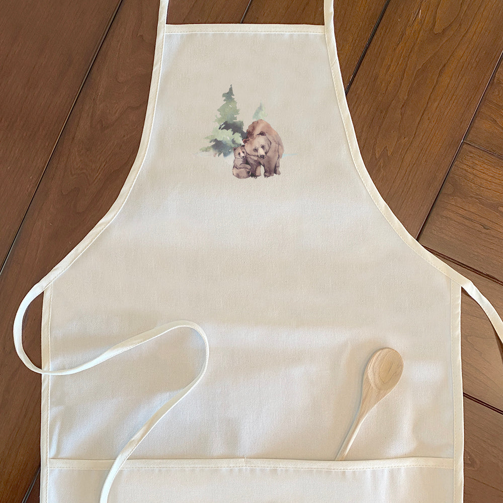 A stylish women's apron featuring a watercolor bear scene design, made from durable cotton canvas with natural twill ties.