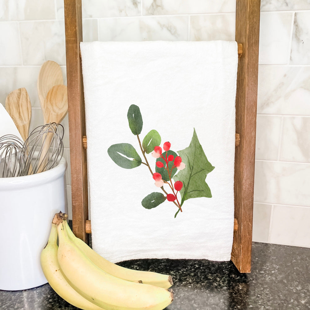 A vibrant Watercolor Holly Sprig Cotton Tea Towel featuring a beautiful holly design, perfect for festive kitchen decor.