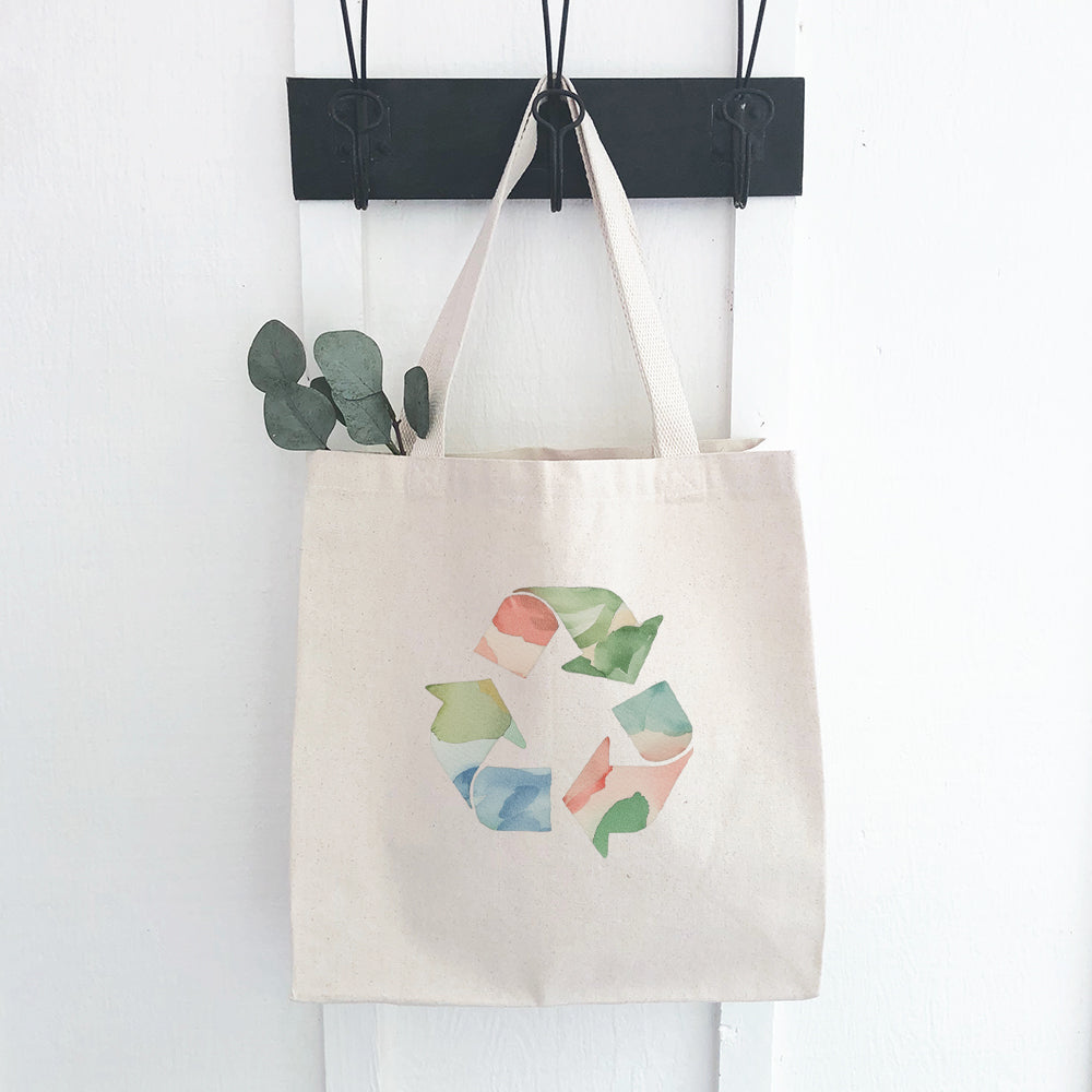 A stylish Watercolor Recycling Canvas Tote Bag featuring a vibrant watercolor design, made from durable 12 oz. canvas fabric.