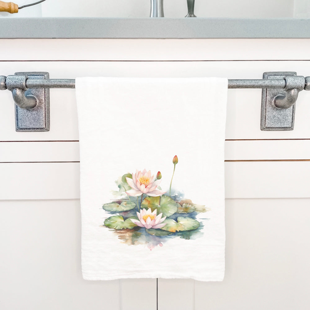 A beautifully designed cotton tea towel featuring vibrant watercolor water lilies, perfect for kitchen use.