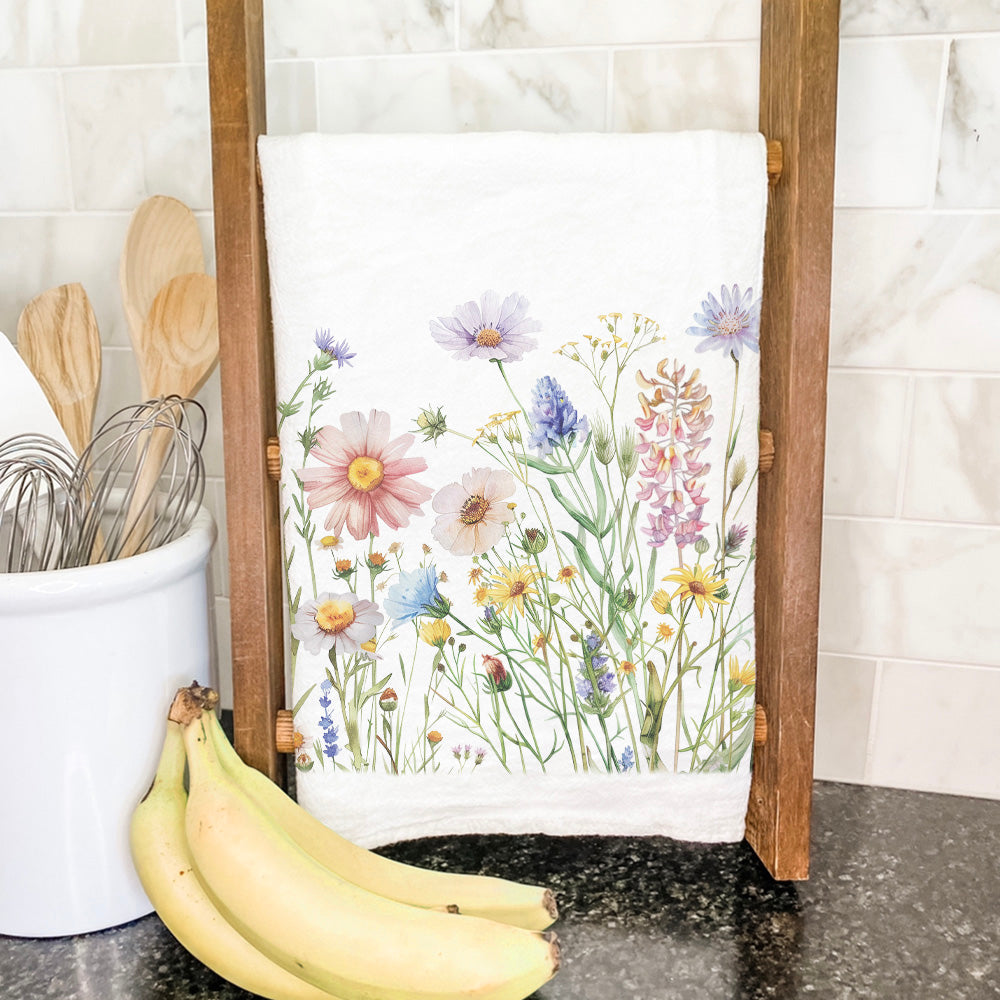 A vibrant Wildflowers Cotton Tea Towel featuring a colorful floral design, made from 100% absorbent cotton, perfect for kitchen use.