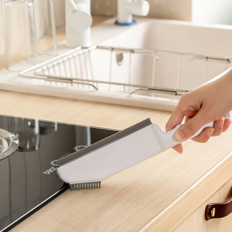 A lightweight and durable Window Silicone Multifunctional All Purpose Cleaning Brush with soft round heads and a side scraper for efficient cleaning.