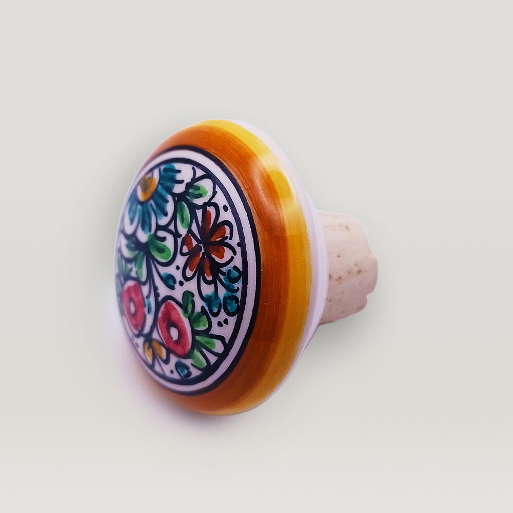 Handcrafted wine bottle stopper made of handpainted ceramic and cork, featuring a luxurious design and perfect round shape.