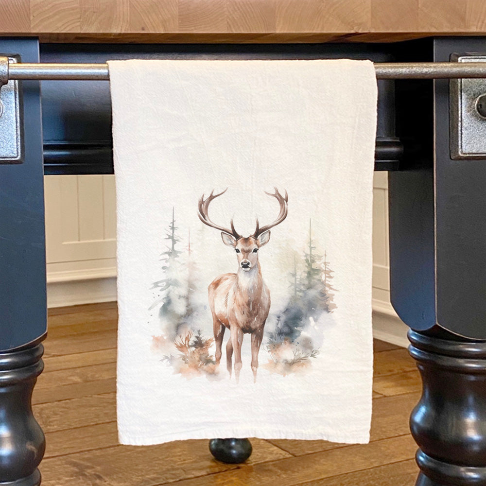 Winter Buck Scene Cotton Tea Towel featuring a vibrant design of a buck in a winter landscape, made from 100% absorbent cotton.