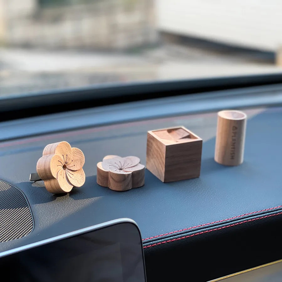 A beautifully crafted wooden essential oil diffuser, showcasing its natural wood grain and compact design, perfect for travel and aromatherapy.