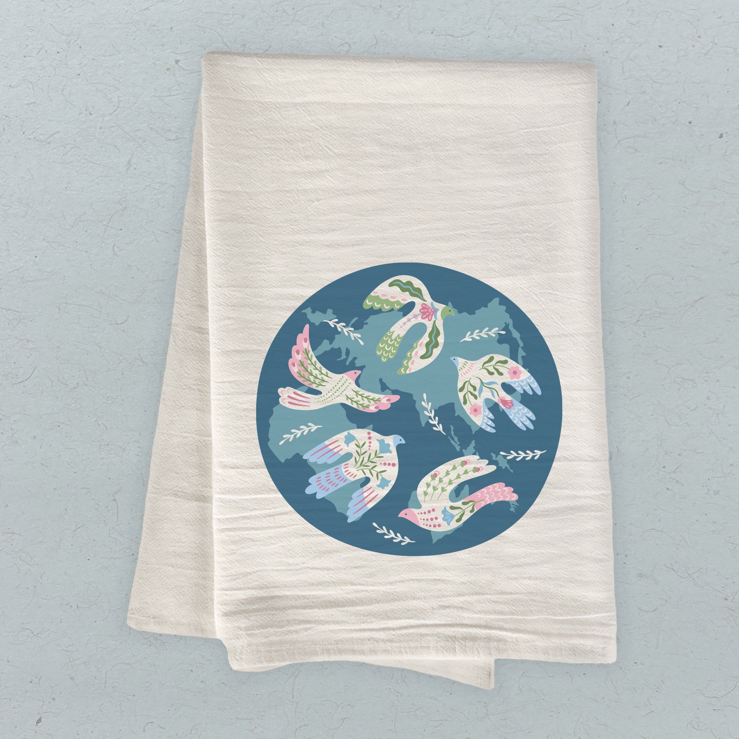 World Doves Cotton Tea Towel featuring a vibrant dove design, made from 100% absorbent cotton, measuring 27 inches square.