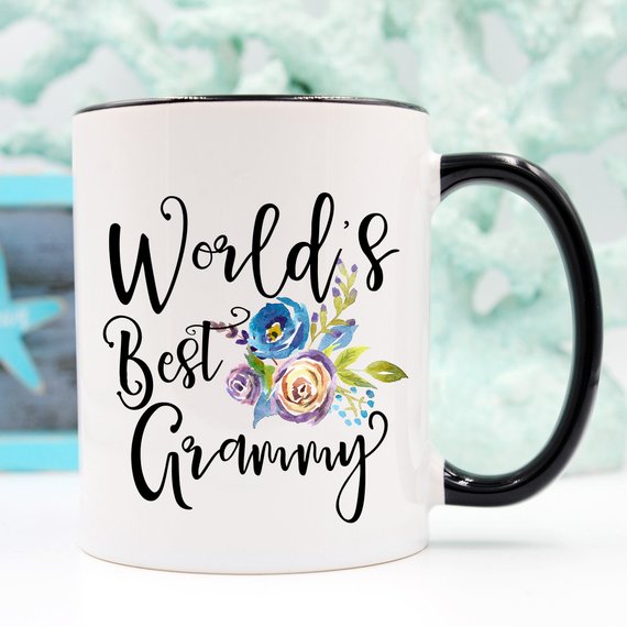 A white ceramic mug featuring the text 'World's Best Grammy' printed on both sides, showcasing a vibrant design.