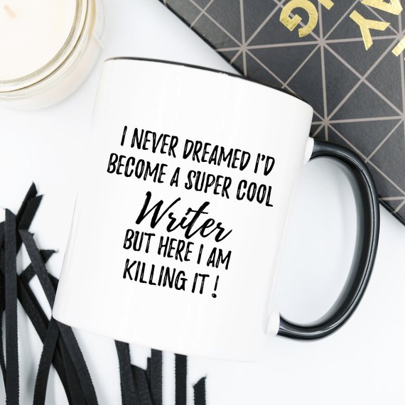 A stylish white ceramic Writer Mug featuring a vibrant design on both sides, perfect for coffee or tea.