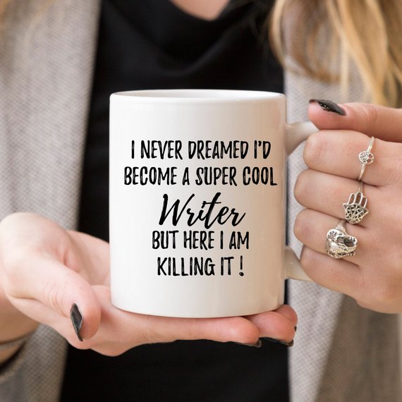 A stylish white ceramic Writer Mug featuring a vibrant design on both sides, perfect for coffee or tea.