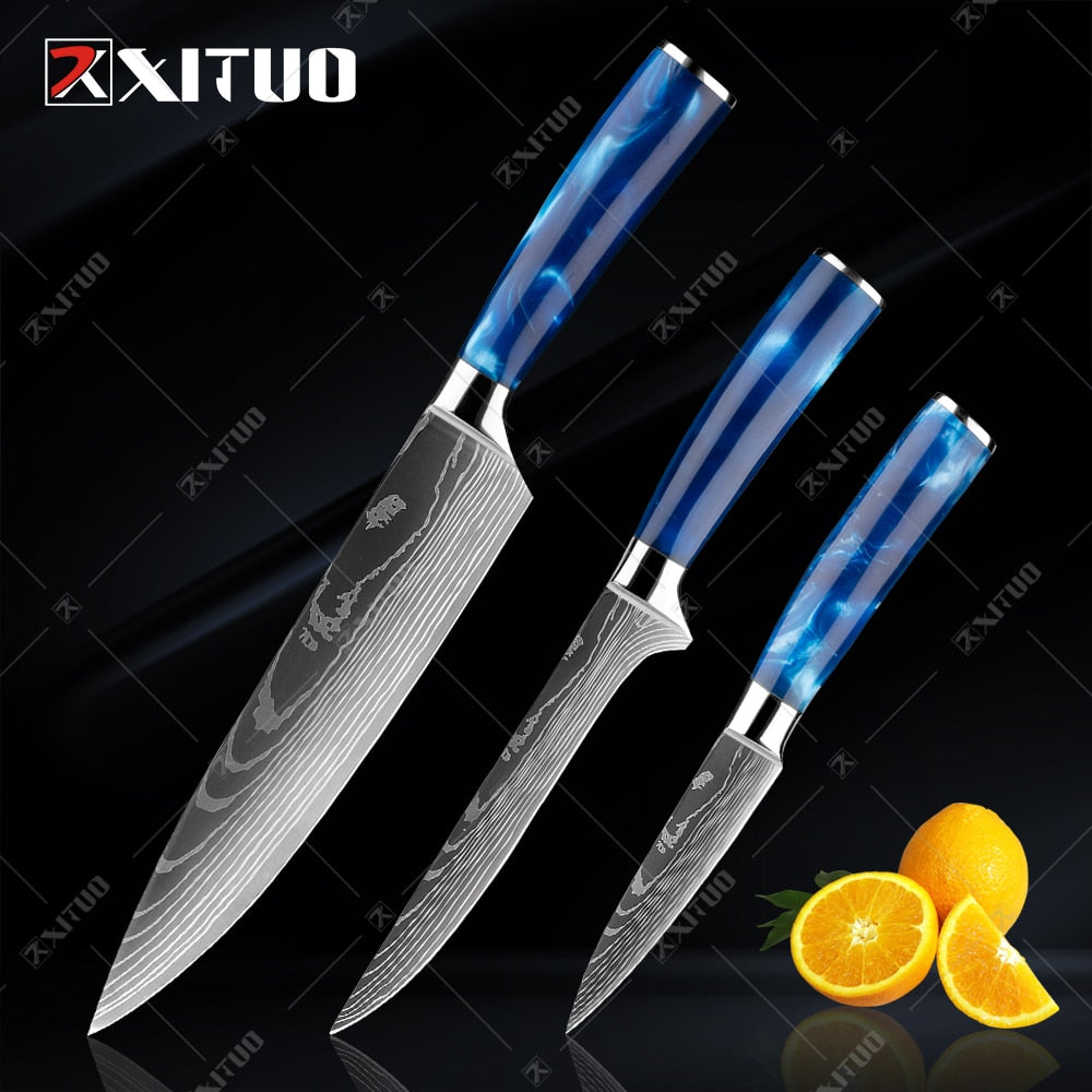 XITUO kitchen knives set featuring blue resin handles and laser Damascus blades, elegantly displayed in a knife holder.