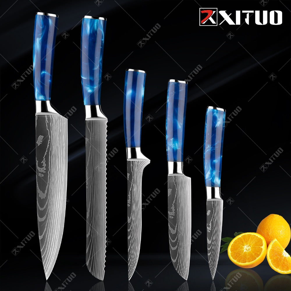 XITUO kitchen knives set featuring blue resin handles and laser Damascus blades, elegantly displayed in a knife holder.