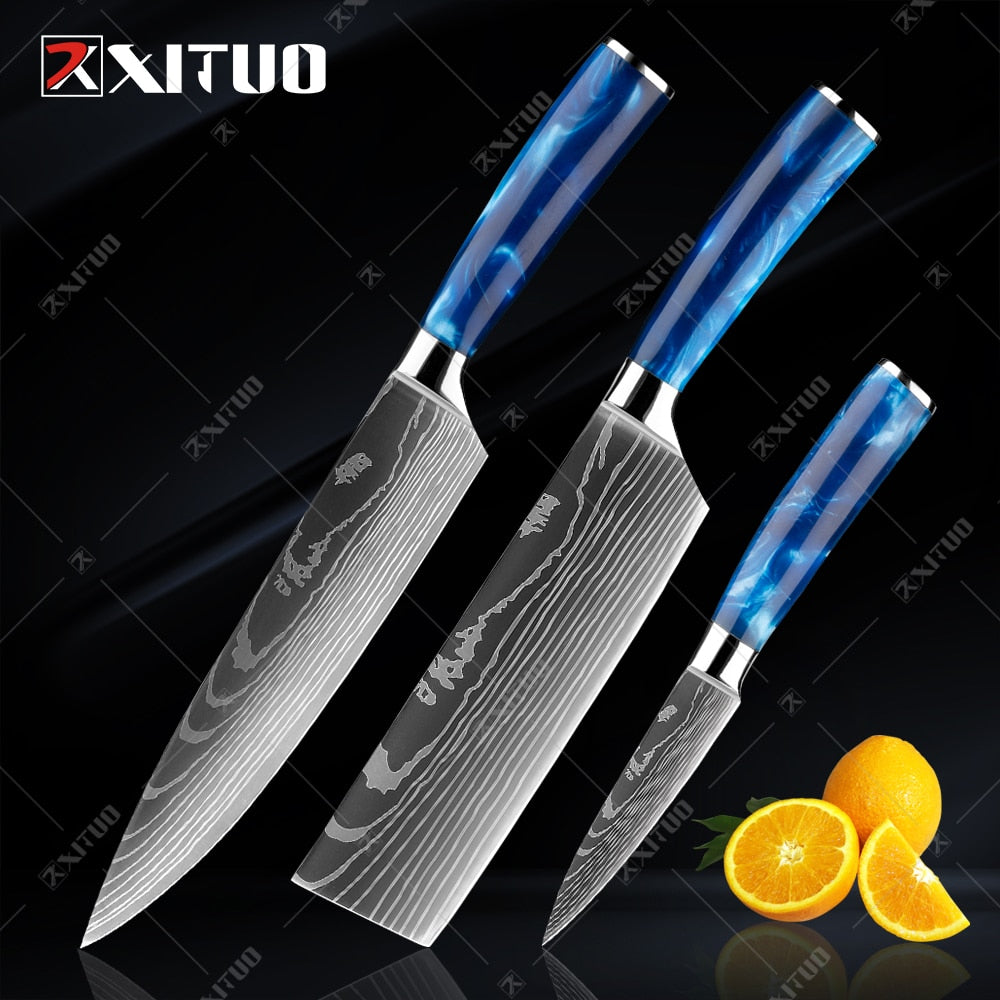 XITUO kitchen knives set featuring blue resin handles and laser Damascus blades, elegantly displayed in a knife holder.