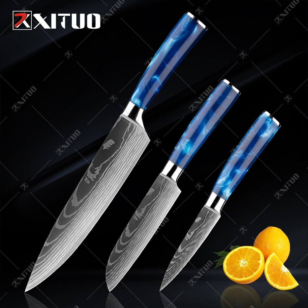 XITUO kitchen knives set featuring blue resin handles and laser Damascus blades, elegantly displayed in a knife holder.