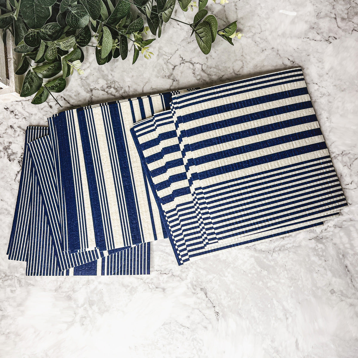 Yacht Club Biodegradable Cloth in three stylish designs, perfect for eco-friendly cleaning in kitchens and bathrooms.