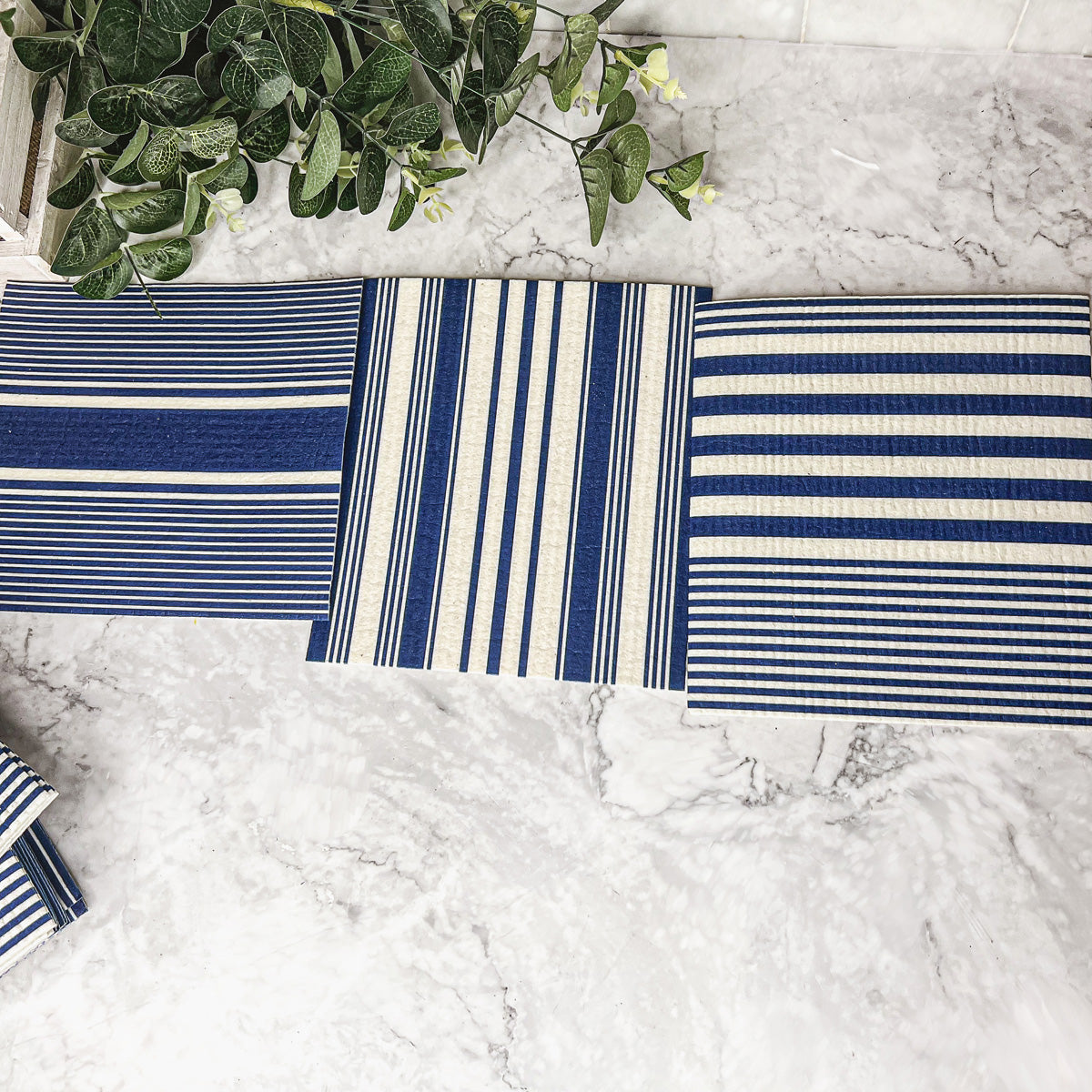 Yacht Club Biodegradable Cloth in three stylish designs, perfect for eco-friendly cleaning in kitchens and bathrooms.