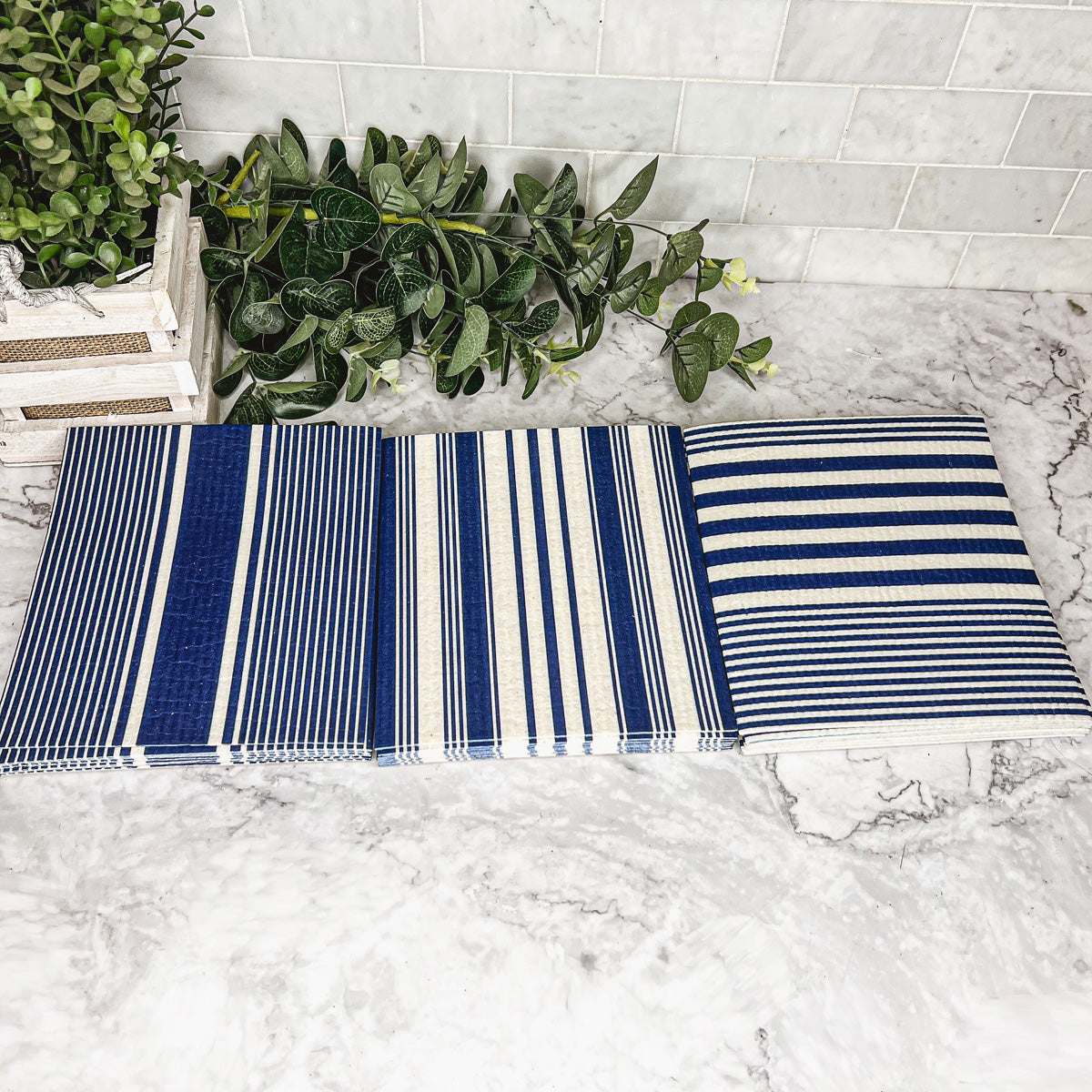 Yacht Club Biodegradable Cloth in three stylish designs, perfect for eco-friendly cleaning in kitchens and bathrooms.