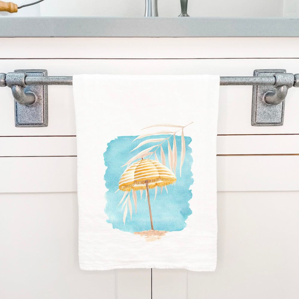 A vibrant Yellow Umbrella Cotton Tea Towel featuring a beautiful design, made from 100% absorbent cotton, perfect for kitchen use.