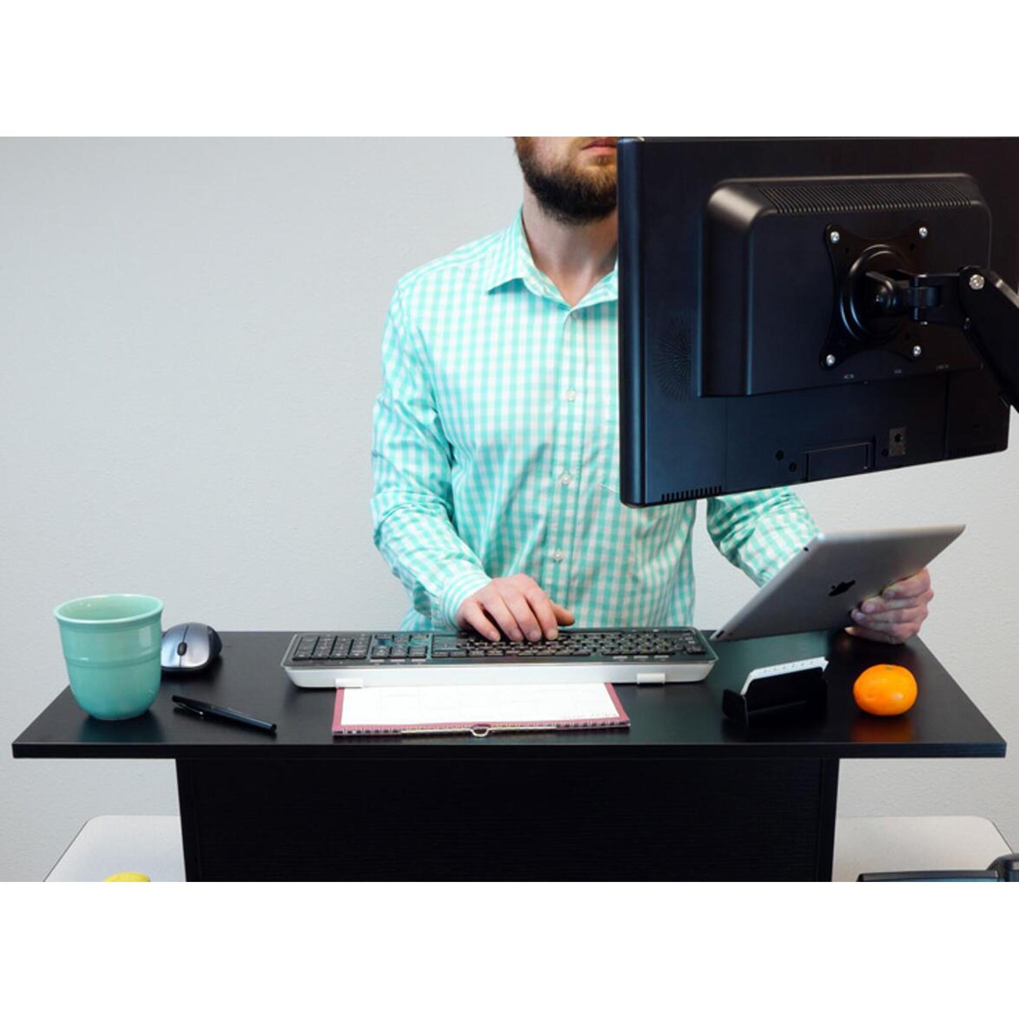 12-inch Miracle Desk Portable Black, a lightweight standing desk with a wood-grained black finish, designed to enhance workspace ergonomics.