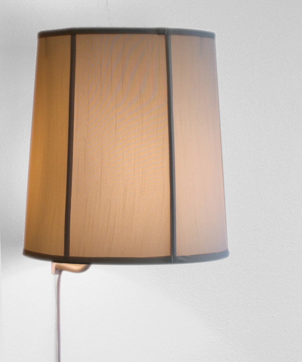 14-inch Floating Shade Plug-In Wall Light in Eggshell, showcasing a minimalist design with a floating lampshade effect.