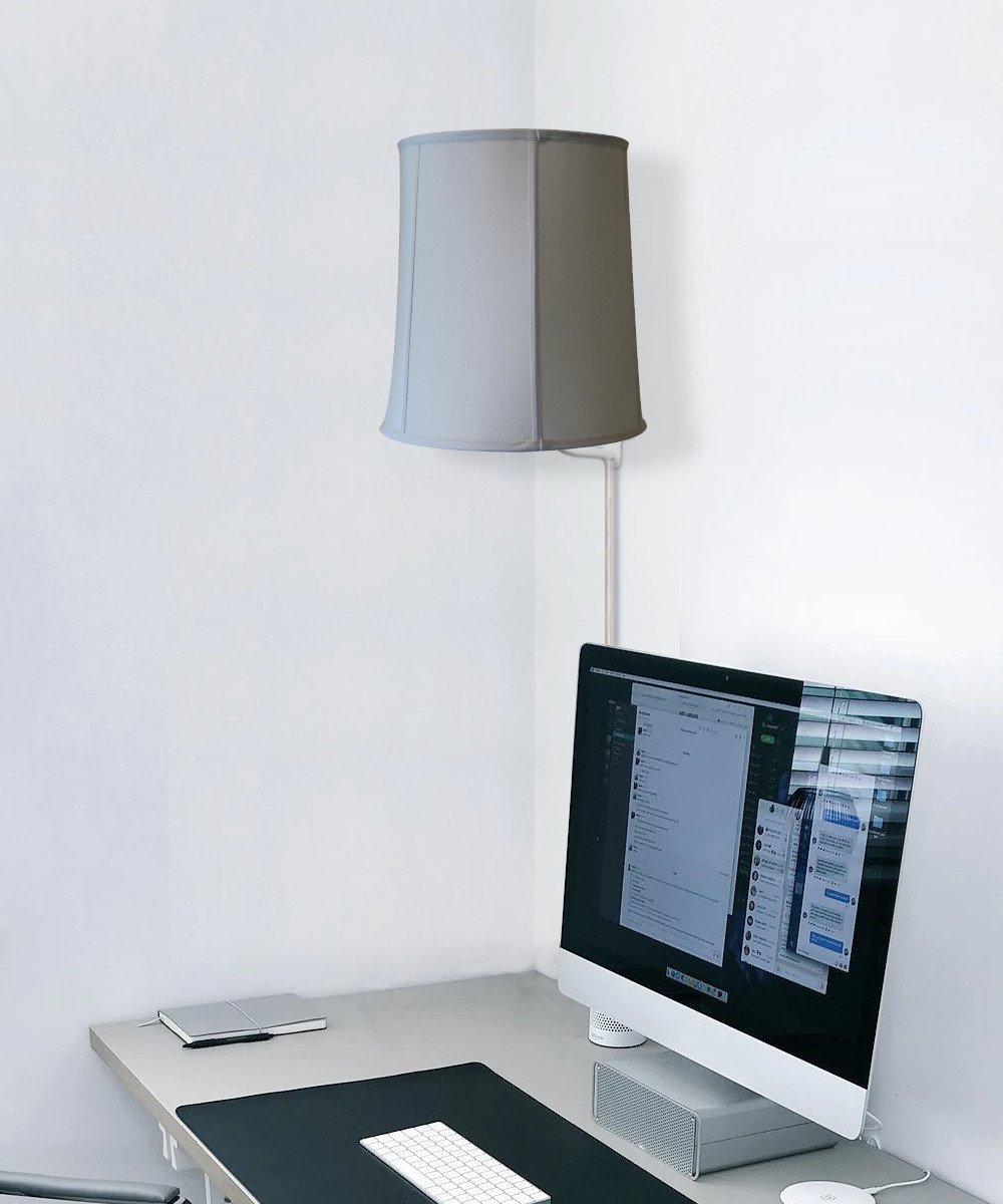 14-inch Floating Shade Plug-In Wall Light in Eggshell, showcasing a minimalist design with a floating lampshade effect.