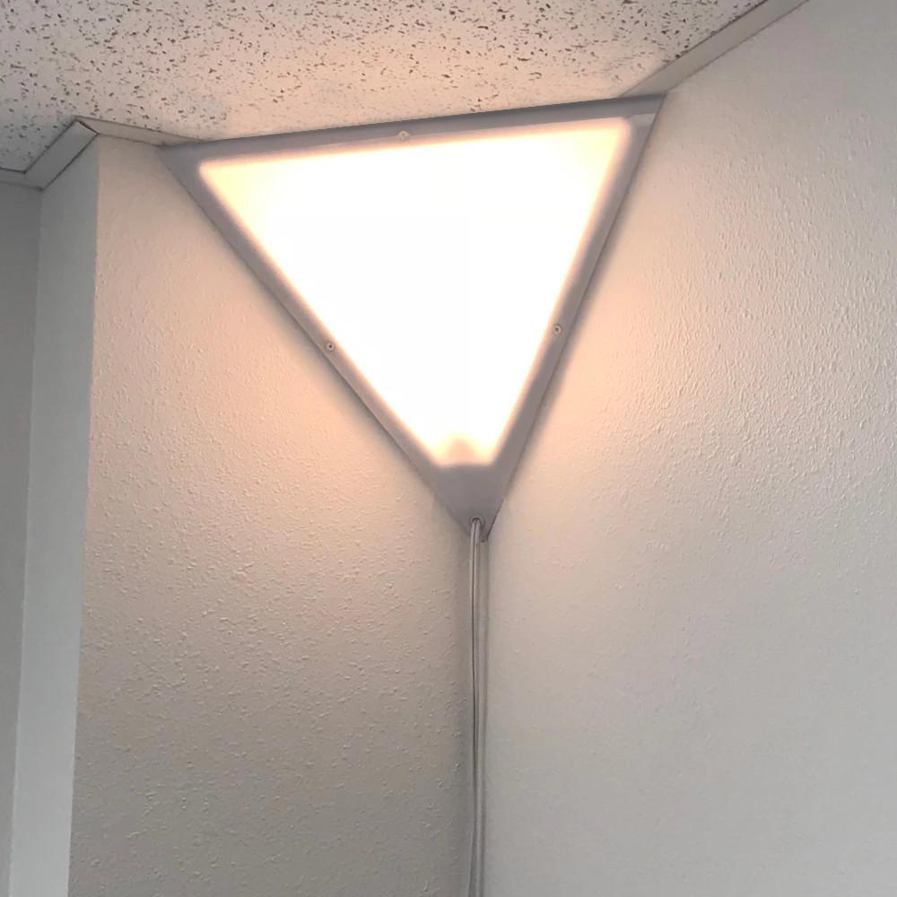 16-inch Beacon Triangle Corner Light in white, featuring a unique triangular design with a frosted acrylic diffuser, perfect for illuminating dark corners.