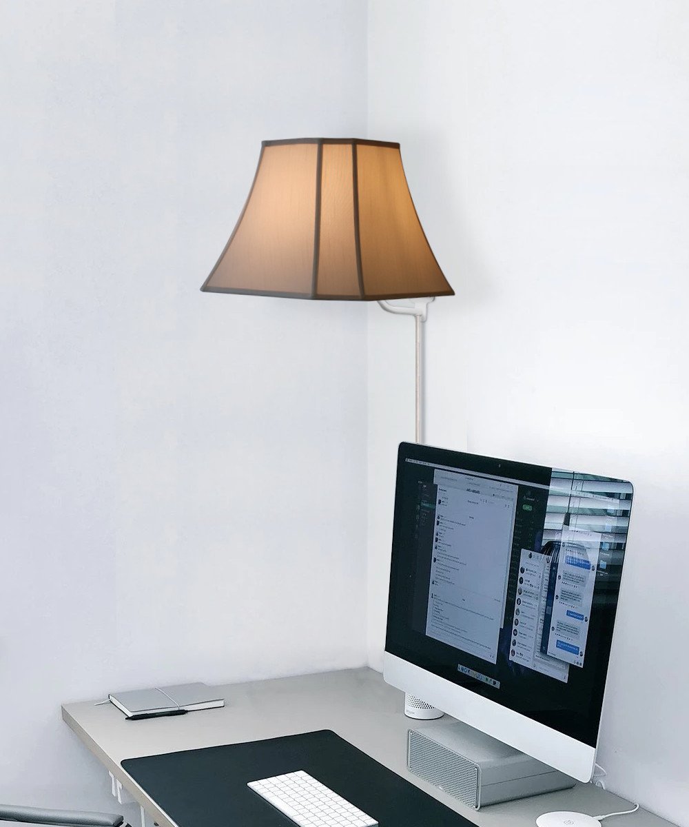 16-inch floating shade plug-in wall light in eggshell color, featuring a minimalist design with a lampshade that appears to float on the wall.