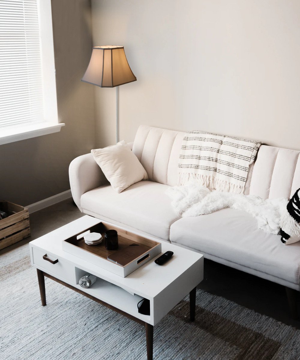 16-inch floating shade plug-in wall light in eggshell color, featuring a minimalist design with a lampshade that appears to float on the wall.