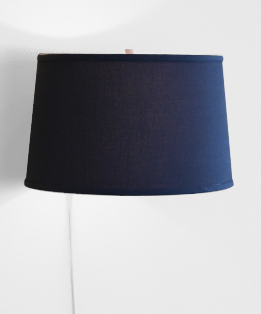 16-inch floating shade plug-in wall light with textured slate blue fabric, minimalist design, and rotary dimmer switch.