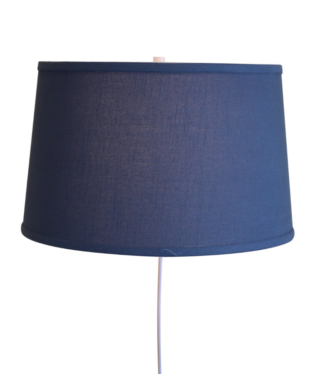 16-inch floating shade plug-in wall light with textured slate blue fabric, minimalist design, and rotary dimmer switch.