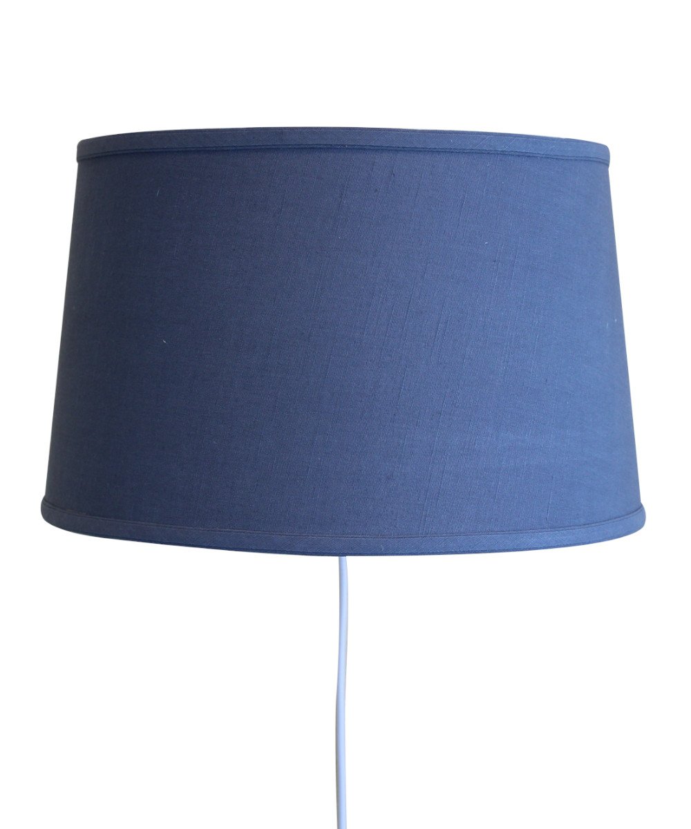 16-inch floating shade plug-in wall light with textured slate blue fabric, minimalist design, and rotary dimmer switch.