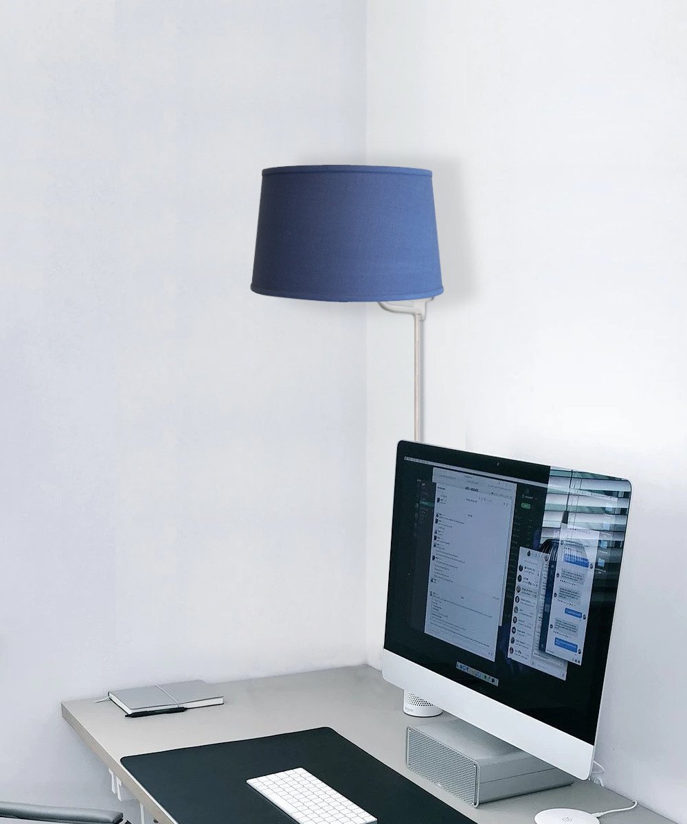 16-inch floating shade plug-in wall light with textured slate blue fabric, minimalist design, and rotary dimmer switch.