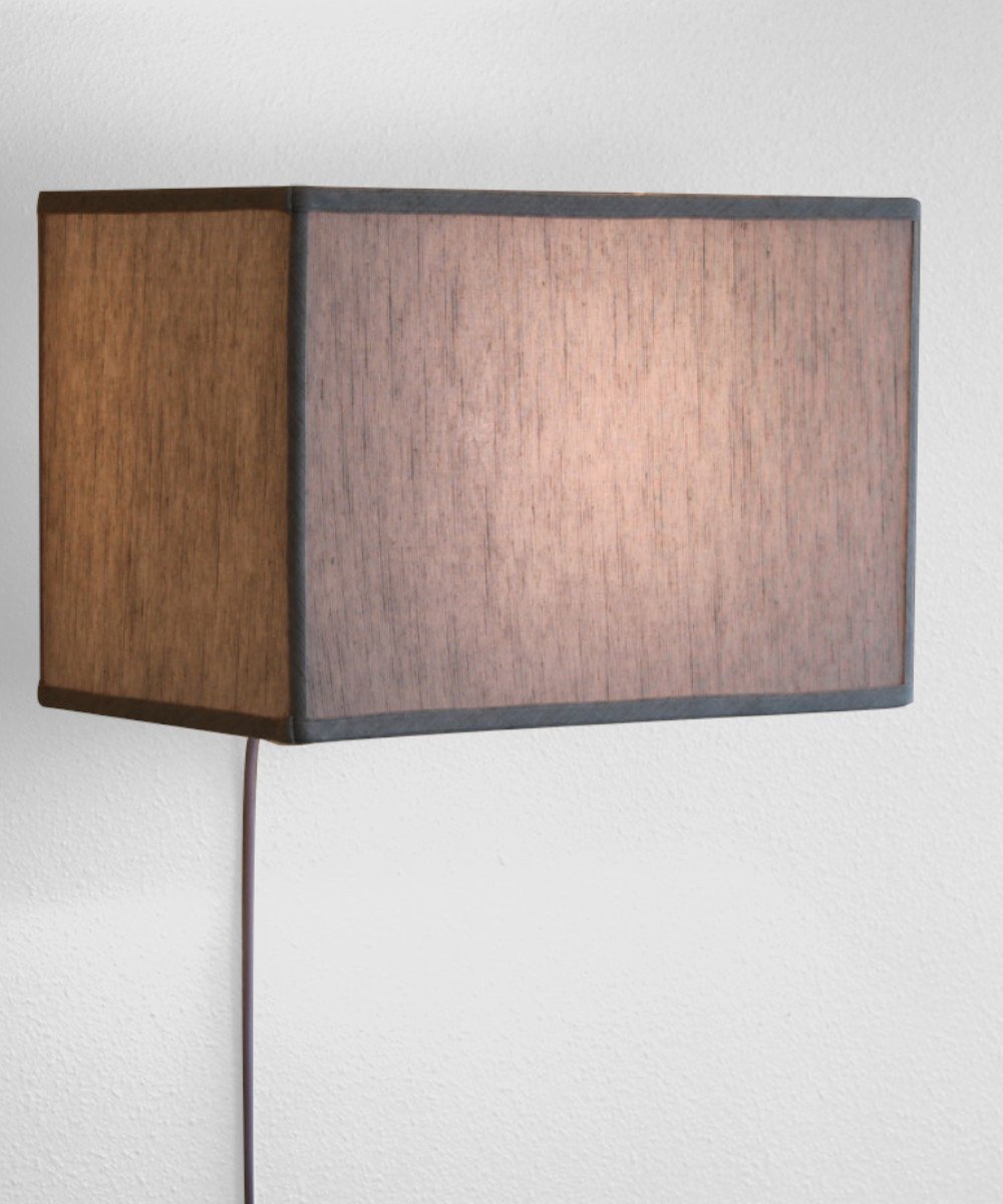 16-inch Floating Shade Plug-In Wall Light with textured oatmeal fabric shade, showcasing a minimalist design that appears to float on the wall.