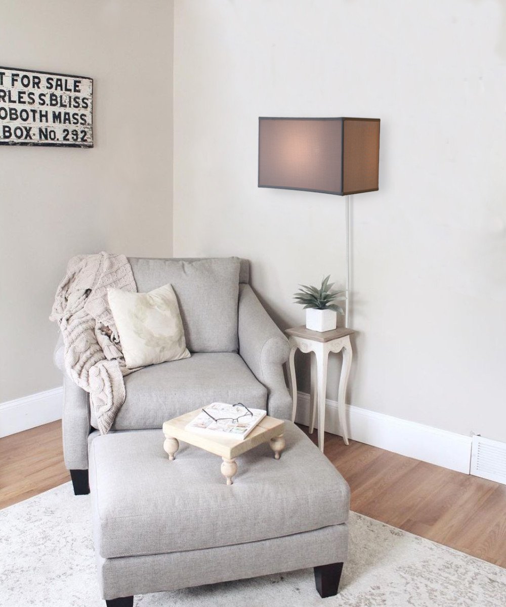 16-inch white floating shade plug-in wall light with a minimalist design, featuring a fabric lampshade and a rotary dimmer switch.