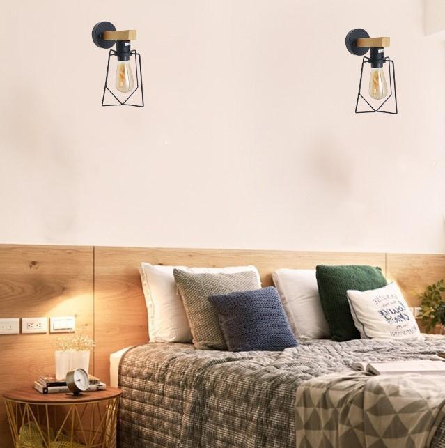 Two modern industrial retro wall lights with wooden and wire frame design, showcasing soft lighting and included bulbs.