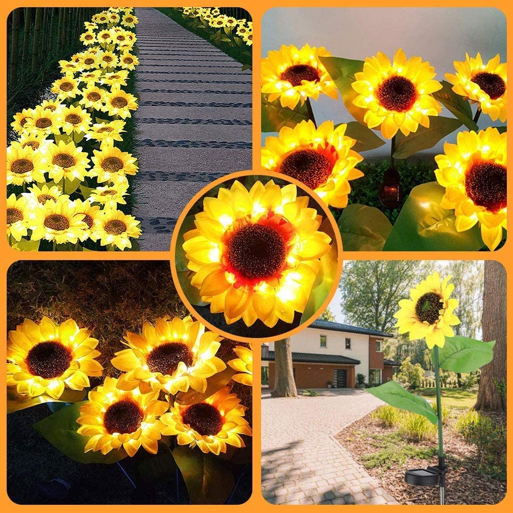 Two solar-powered sunflower lights in a garden setting, showcasing their vibrant yellow color and elegant design.