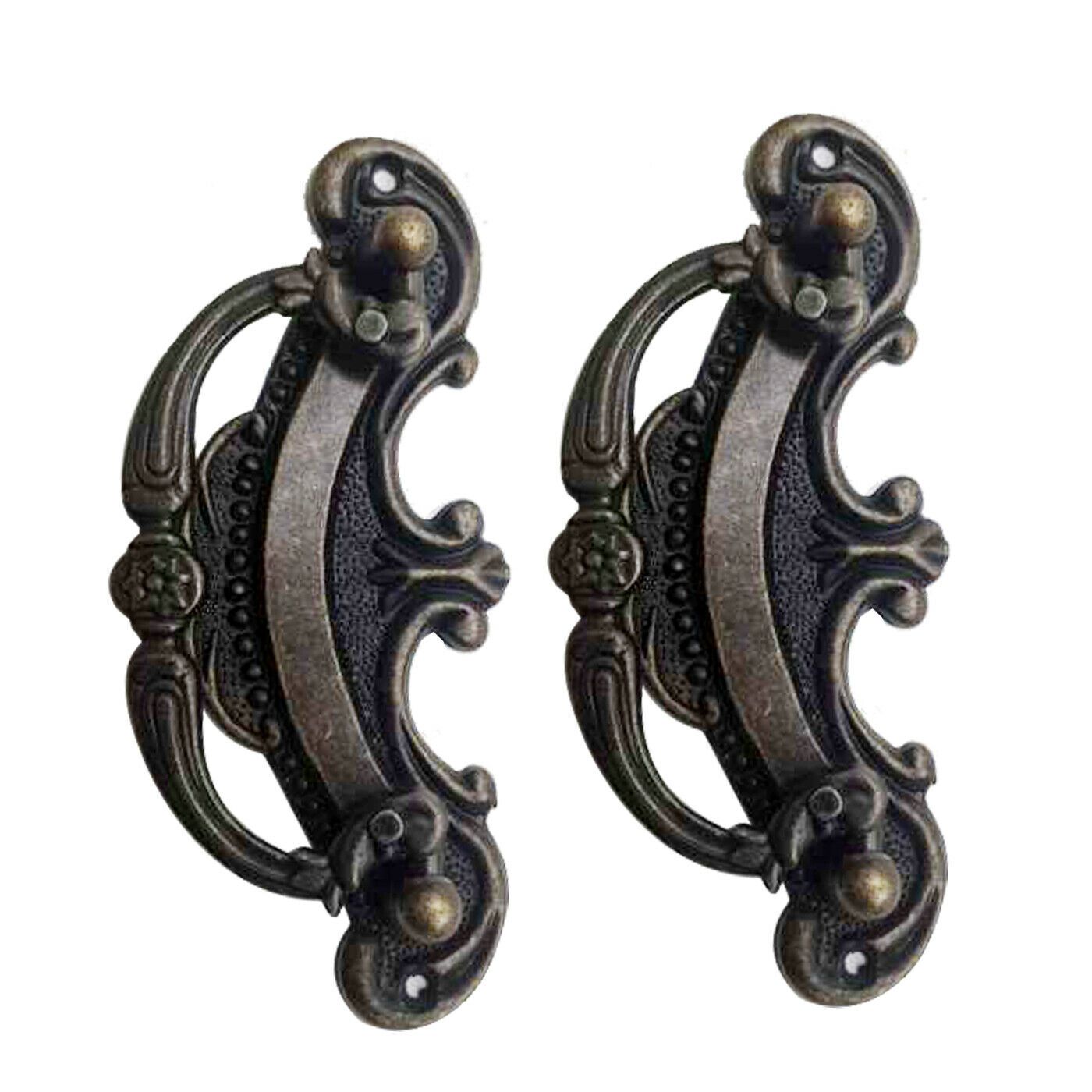 A set of five antique rustic style cast iron door handles, showcasing a vintage design with a rustic brass finish, ideal for cabinets and drawers.