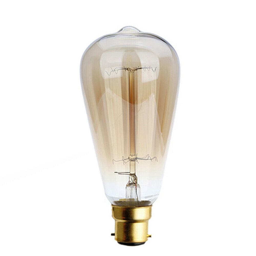 A pack of six B22 60W Edison vintage filament candle bulbs with a warm amber glow, showcasing their antique design and glass finish.