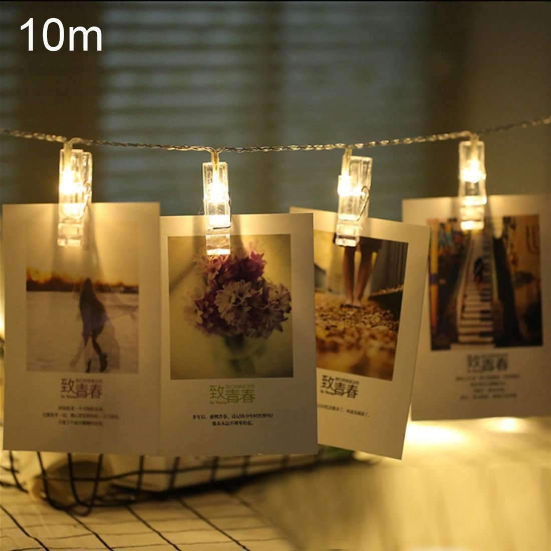 AMZER Fairy Photo Clip String Light featuring 10 LED clips with warm white light, perfect for displaying photos and creating a cozy atmosphere.