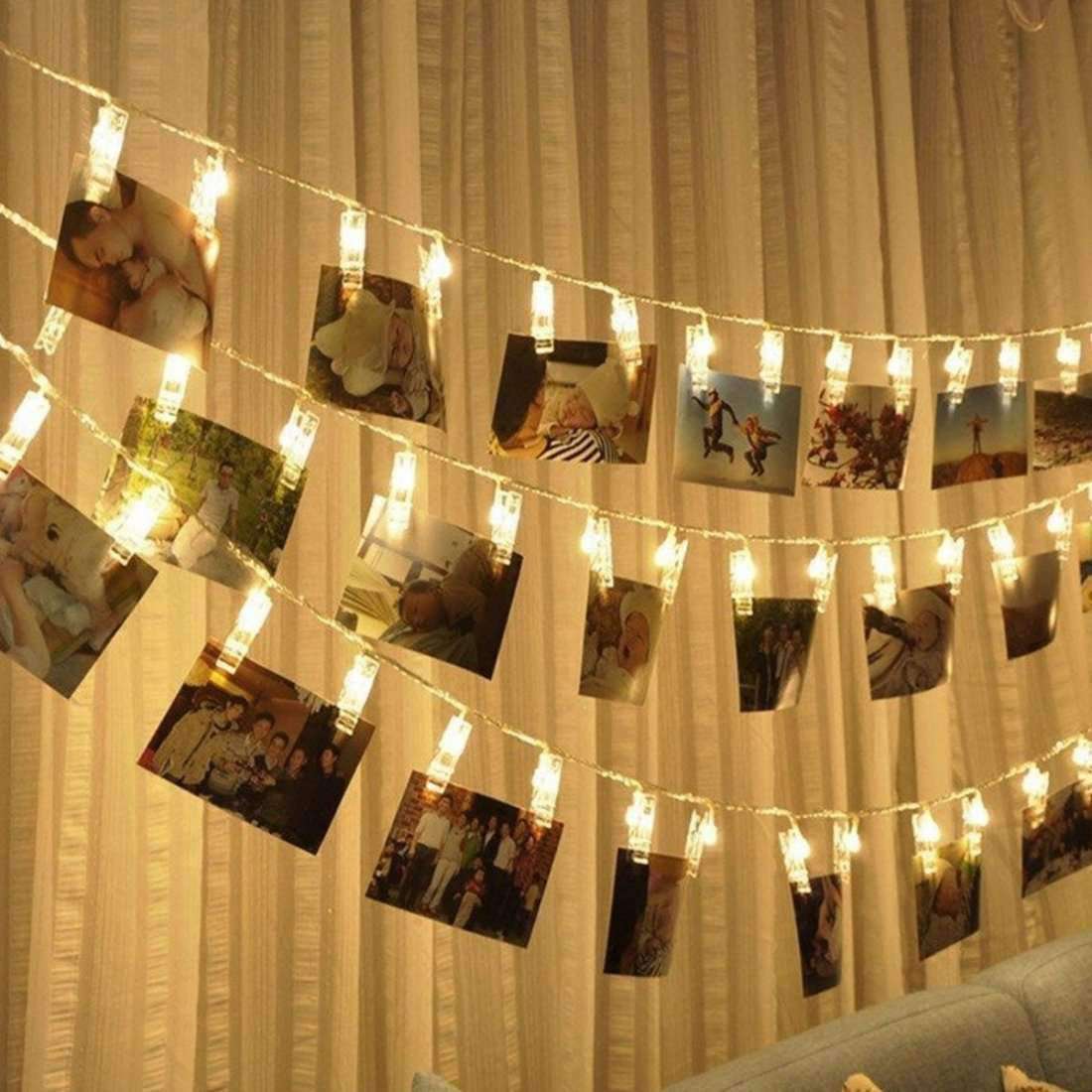 AMZER Fairy Photo Clip String Light featuring 10 LED clips with warm white light, perfect for displaying photos and creating a cozy atmosphere.