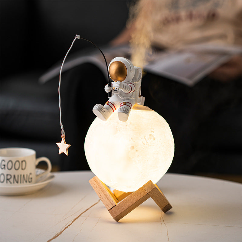 A stylish astronaut figurine night light made of resin and wood, featuring a modern Nordic design, perfect for home decoration.