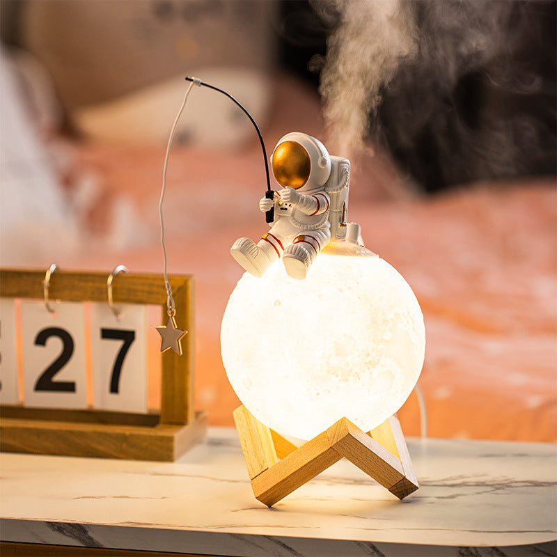 A stylish astronaut figurine night light made of resin and wood, featuring a modern Nordic design, perfect for home decoration.